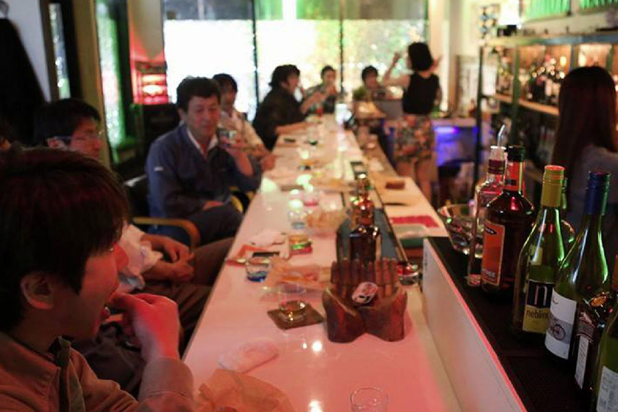 People enjoying drinks at a local snack